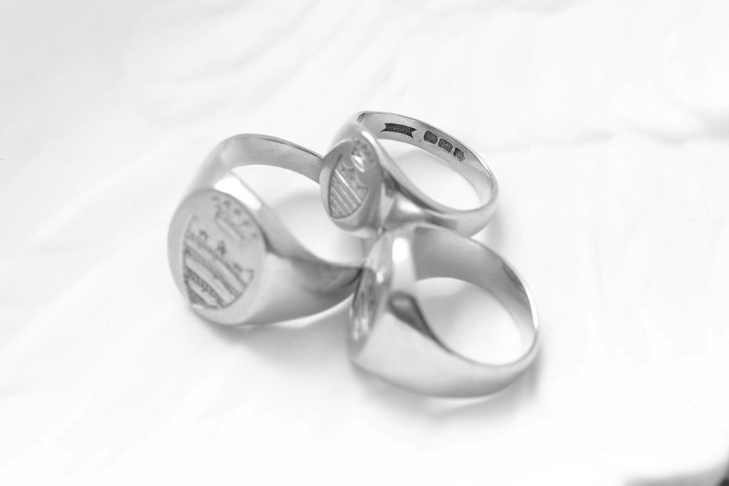 A Set of Three Gold Signet Rings for One Family