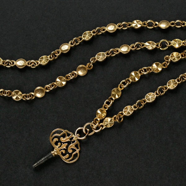Victorian Ornate Gold Watch Chain with a Key